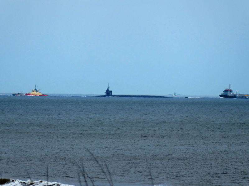 Submarine being Escorted In for Repairs